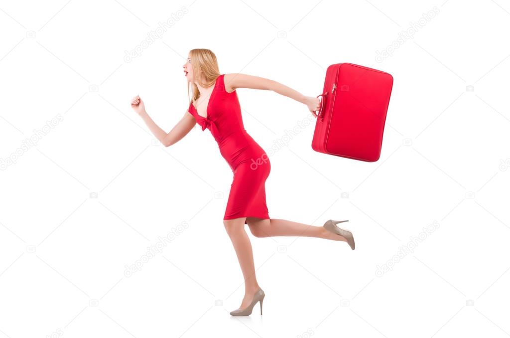 Blondie in red dress with suitcase isolated on white