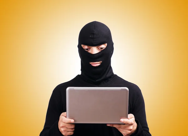 HHacker with computer wearing balaclava — Stock Photo, Image