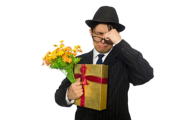 Herr mit Geschenkkarton und Blumen isoliert auf weiß — Stockfoto