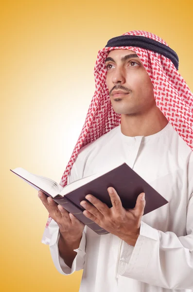 Arab man praying on yellow — Stock Photo, Image