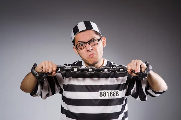 Young prisoner against gray — Stock Photo, Image