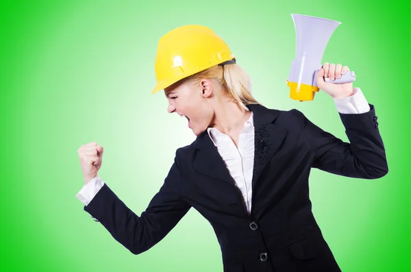 Female construction worker with loudspeaker — Stock Photo, Image