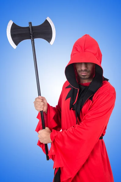 Executioner in red costume with axe on blue — Stock Photo, Image