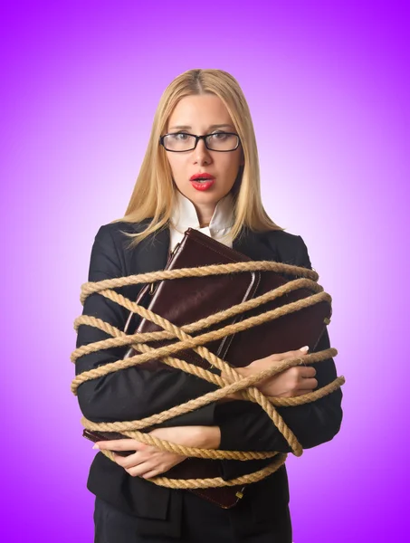 Businessman tied up with rope — Stock Photo, Image