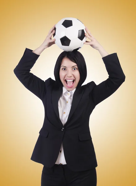 Businesswoman with ball on brown — Stock Photo, Image