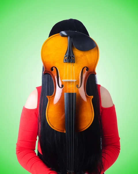 Young girl with violin on green — Stock Photo, Image