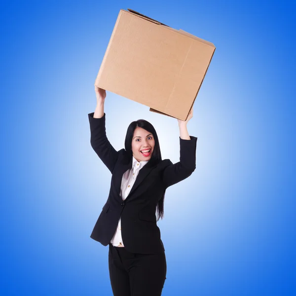 Mujer con muchas cajas en azul —  Fotos de Stock