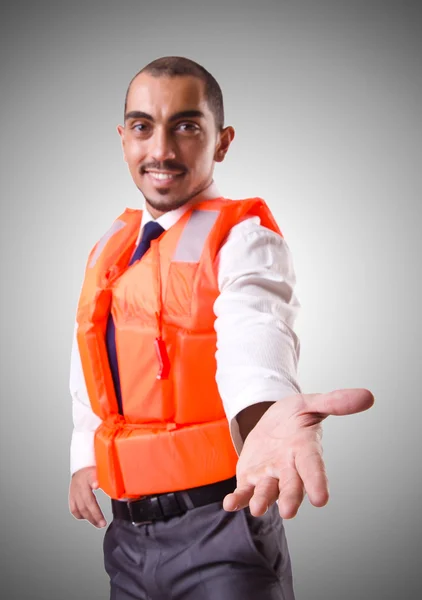 Man in life jacket isolated on silver — Stock Photo, Image