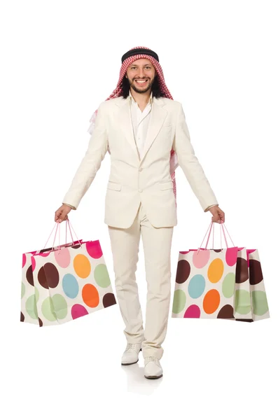 Arap adam alışveriş torbaları üzerinde beyaz ile — Stok fotoğraf