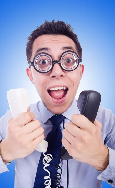 Loco hombre con teléfonos en azul — Foto de Stock