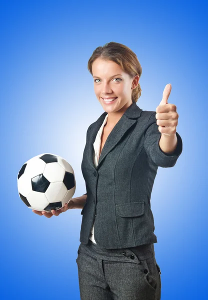 Businesswoman with football on white — Stock Photo, Image