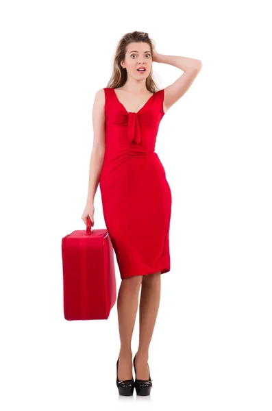 Young woman in red dress with suitcase isolated on white — Stock Photo, Image