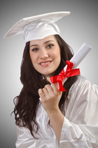 Szczęśliwy absolwent na białym tle — Zdjęcie stockowe