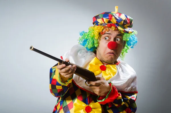 Clown with rifle isolated on white — Stock Photo, Image