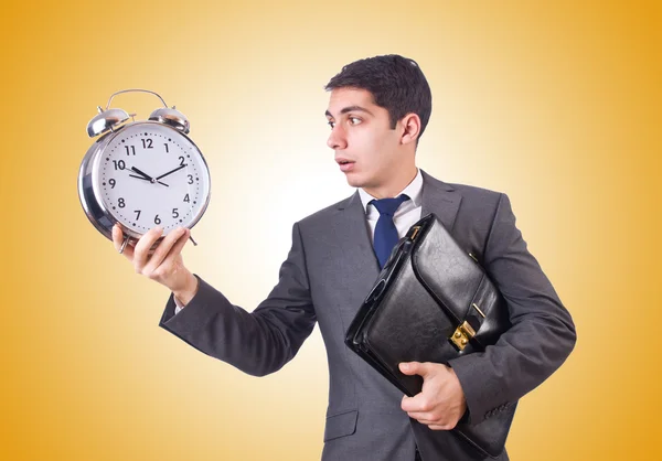 Businessman with clock isolated on white — Stock Photo, Image