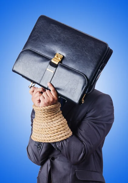 Businessman tied up with rope — Stock Photo, Image