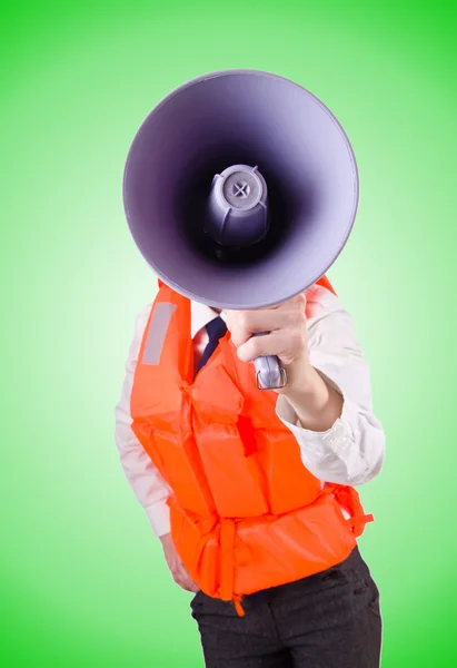 Young woman with vest and loudspeaker on white — Stock Photo, Image