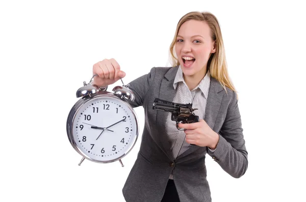 Mujer de negocios en traje gris con reloj despertador aislado en blanco —  Fotos de Stock