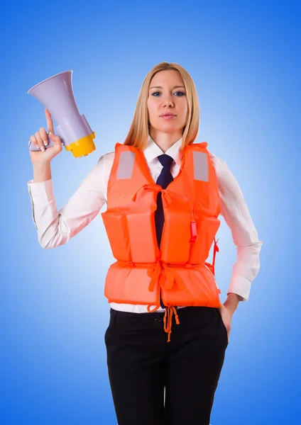Young woman with vest and loudspeaker on white — Stock Photo, Image