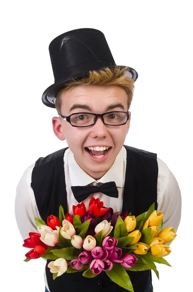 Lächelnder Herr mit Blumen auf weißem Grund — Stockfoto