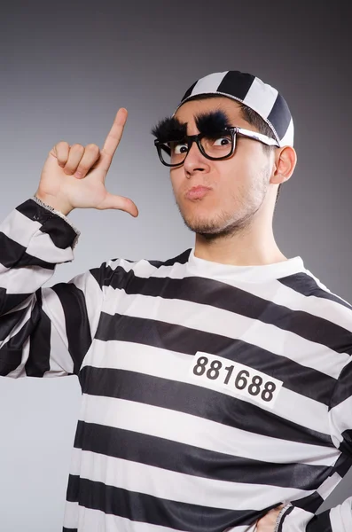 Young prisoner against gray — Stock Photo, Image