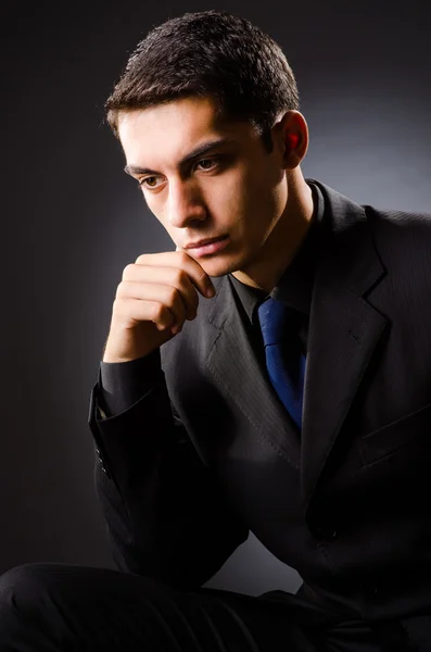 Young elegant man against gray Royalty Free Stock Images