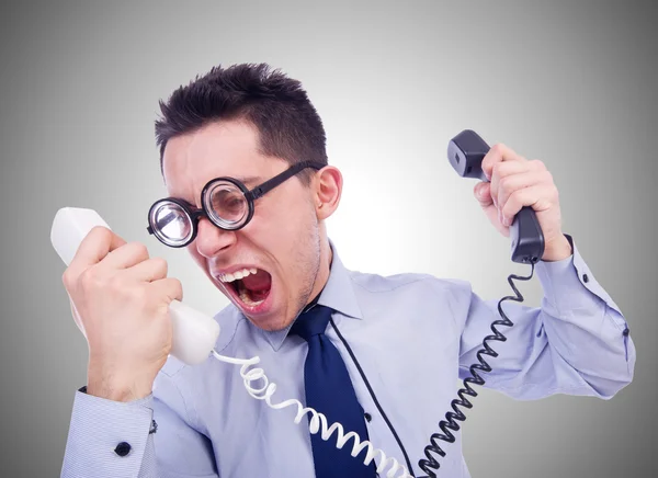 Crazy man with phones on silver Stock Image