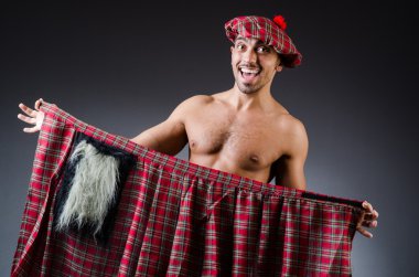 Man wearing traditional scottish clothing clipart