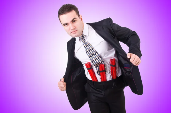 Businessman with dynamite isolated on purple — Stock Photo, Image