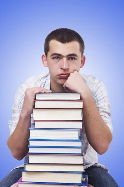 Student with lots of books — Stockfoto