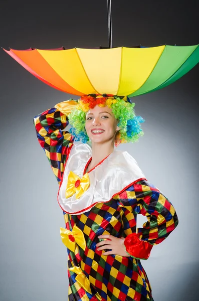 Clown with umbrella in funny concept — Stock Photo, Image