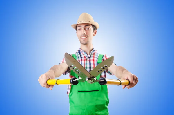 Man gardener with shears — Stock Photo, Image