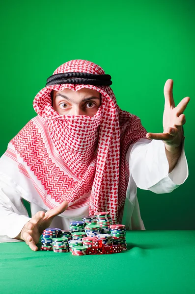 Arab man playing in the casino — Stock Photo, Image