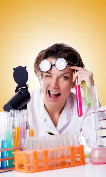 Crazy woman chemist in lab — Stock Photo, Image