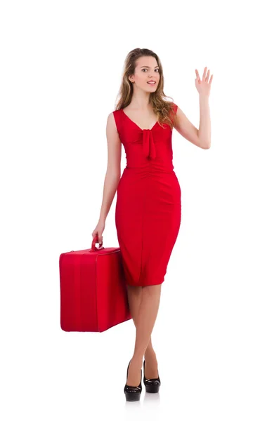 Young woman in red dress with suitcase isolated on white — Stock Photo, Image