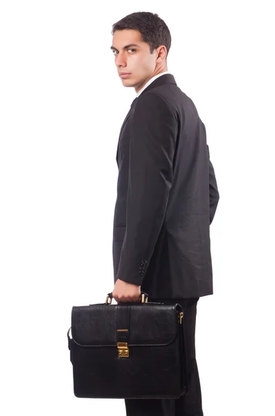 Genç işadamı bavul üzerinde beyaz izole holding — Stok fotoğraf