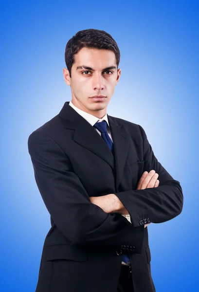 Hombre de negocios guapo aislado en azul — Foto de Stock