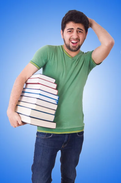 Student with lots of books — Stockfoto