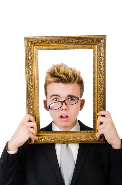 Jovem empresário segurando quadro de imagem isolado no branco — Fotografia de Stock