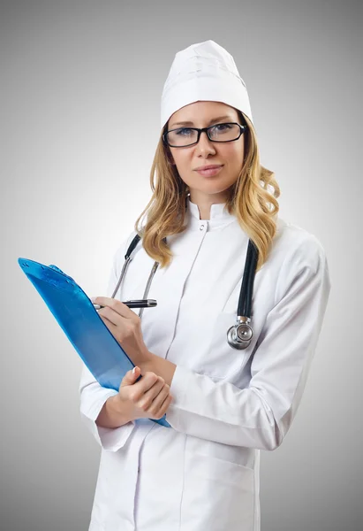 Woman doctor isolated on gray Stock Picture