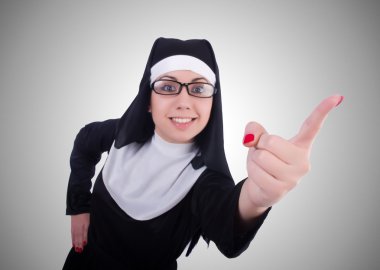 Funny nun isolated on the gray