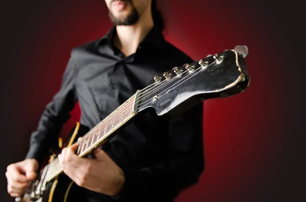 Man with guitar during concert — Stock Photo, Image