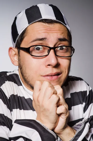 Young prisoner against gray — Stock Photo, Image