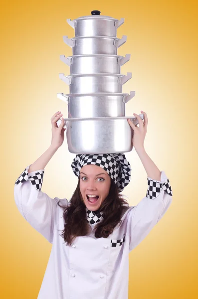Cook with stack of pots — Stock Photo, Image