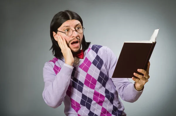 Joven estudiante con libro en concepto de aprendizaje —  Fotos de Stock