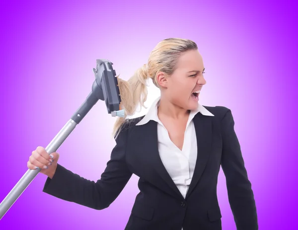 Businesswoman with vacuum cleaner — Stock Photo, Image