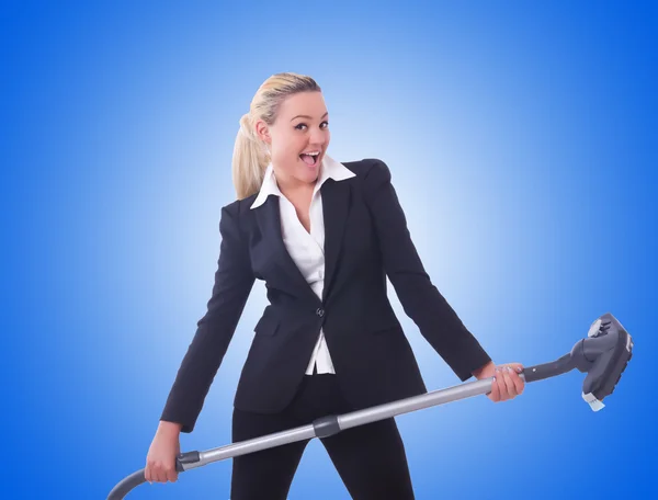 Businesswoman with vacuum cleaner — Stock Photo, Image