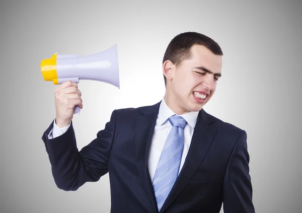 Man met luidspreker geïsoleerd op grijs — Stockfoto