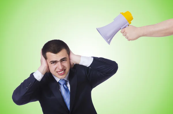 Man with loudspeaker isolated on green — Stock Photo, Image