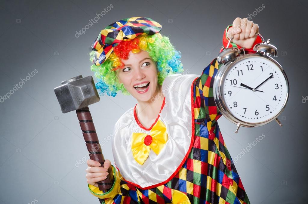 Clown with hammer and clock Stock Photo by ©Elnur_ 85087178